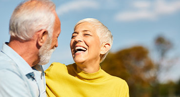 Laughing senior couple feeling their best because of INR Management service